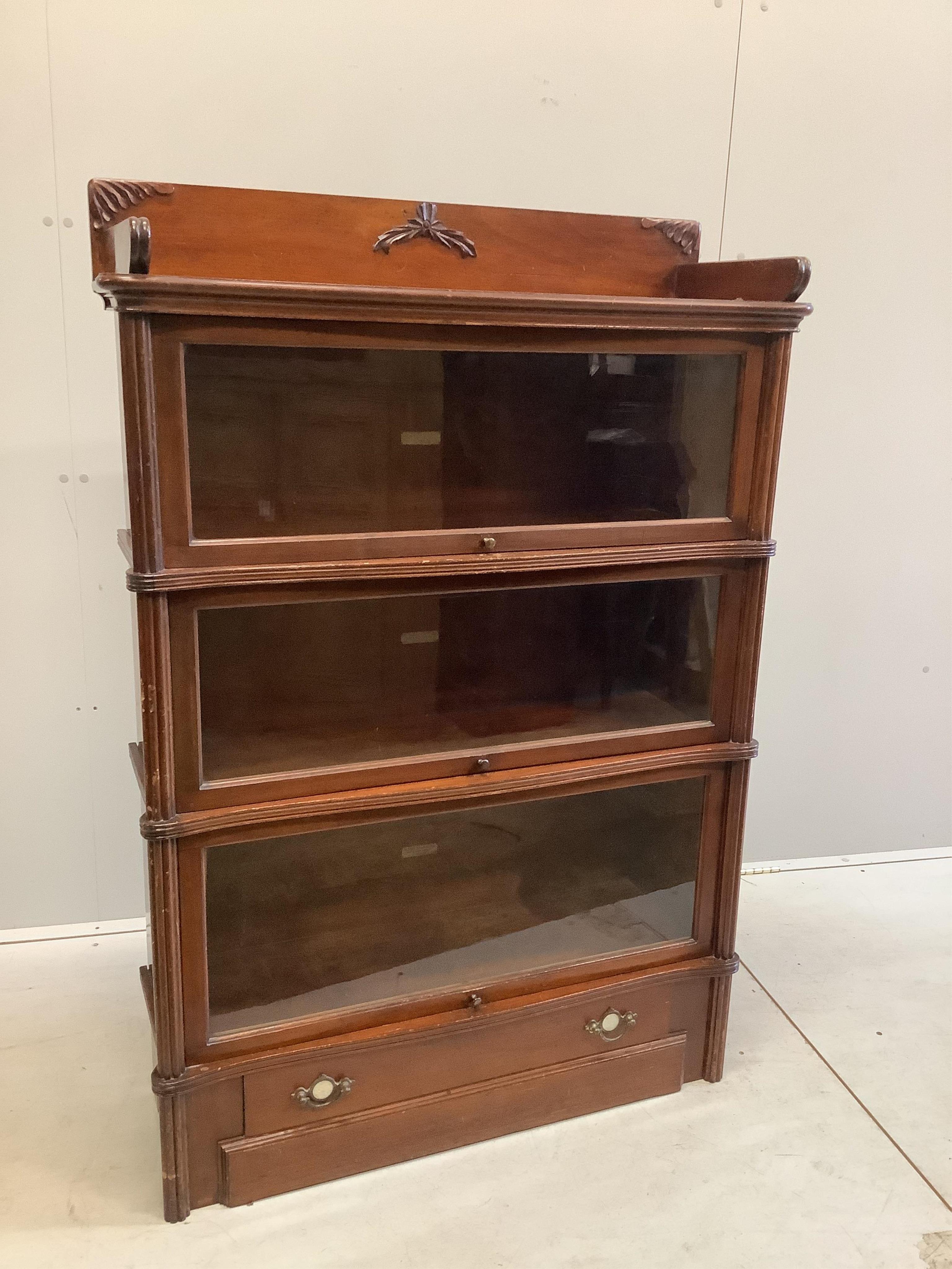 A Globe Wernicke mahogany three section bookcase, width 92cm, depth 33cm, height 135cm. Condition - fair